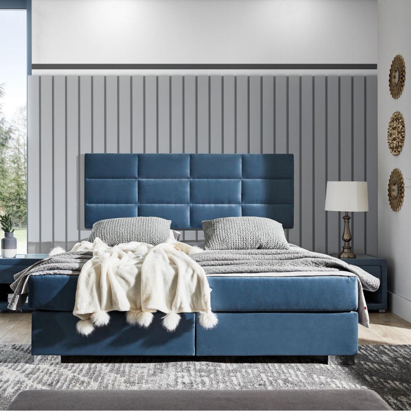 Łoże kontynentalne  z wezgłowiem wieszanym na ścianie pikowanym w foremne prostokąty. Ekonomiczne wymiarowo, nie zajmuje dodatkowego miejsca. Praktyczny pojemnik na stelażu elastycznym. Metalowa noga chromowana.